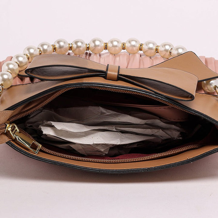 Bow style pink handbag